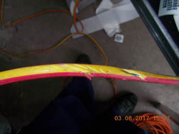 electrical cord shown opposite was in use with live parts exposed